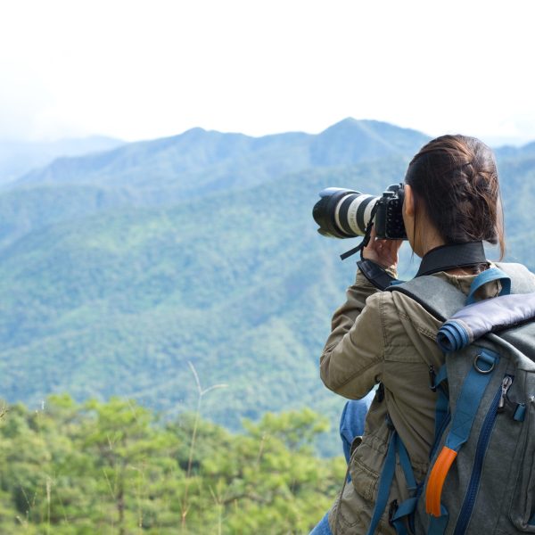 A woman with a camera World photographer day.